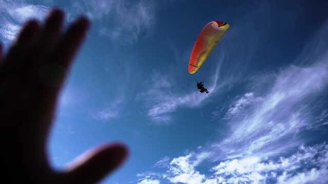 Athlete paragliding against the backdrop of a cloudy sky over the mountains on a summer day Teide volcano