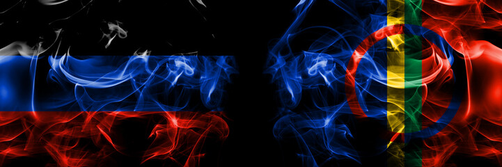 Donetsk People's Republic vs Sami flag. Smoke flags placed side by side isolated on black background.