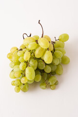 green grapes on white table, white background