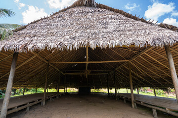 Fototapeta na wymiar Architecture of a maloca in the indigenous community of the Ticunas, San Martin, Amazonia, Colombia