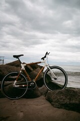 Fototapeta premium Bike on beach (film 35mm)