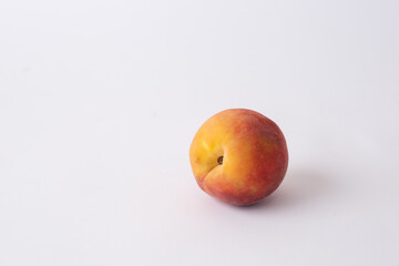 fresh peach on a white meza