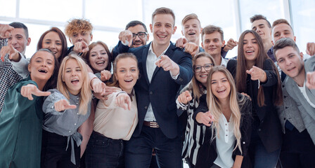 group of ambitious young professionals pointing at the camera