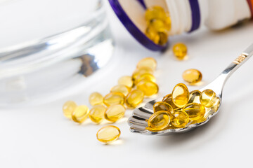 Close up of  oil filled capsules suitable for: fish oil, omega 3, omega 6, omega 9,  vitamin A,...
