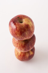 fresh red apples on a white table