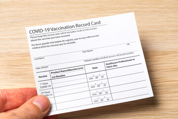 Syringe and vaccine vial for corona virus are on medical form required for travel and tourism. - Image