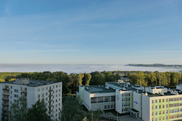 Morning fog in autumn over the city.