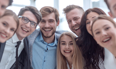 close up.a team of young business people looking at the camera.
