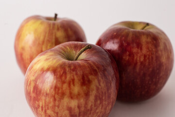 Fototapeta na wymiar fresh red apples on a white table