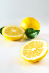 Ripe yellow lemon on white background. Antioxidant for healthy diet.