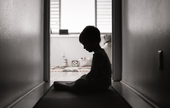 Sad little boy alone at home suffering from depression, bullying, abuse 
