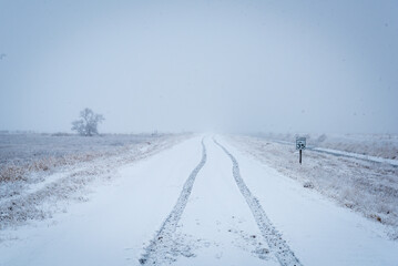 Fototapeta premium cascade mountain roadway in winter with snow and ice