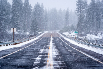 cascade mountain roadway in winter with snow and ice