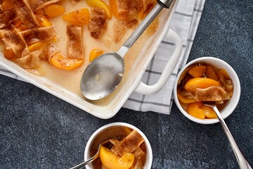 Peach cobbler with spoon