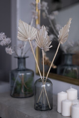 Home decor vase of candles and dried flowers Interior Design