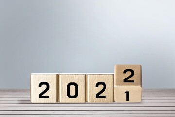 woodblocks cubes with a number 2021 change to 2022 . new year 2021- 2022 concept.