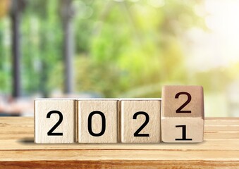 woodblocks cubes with a number 2021 change to 2022 . new year 2021- 2022 concept.