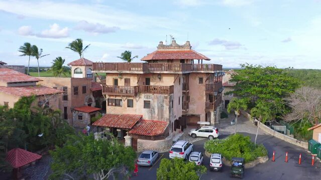 Old Looking House With Cars Parked Outside In Altos de Chavon, Mediterranean-style Village In La Romana. Dominican Republic. drone fly-by