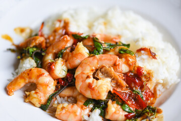Stir fried shrimp, Cooked rice and fried basil with shrimps prawns,Thai food rice topped shrimp with holy basil leaves