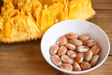 jackfruit seed on white bowl on a wooden background from ripe jackfruit fruit