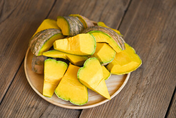 chopped pumpkin, green pumpkin food on on wooden background, fresh Asian Thai pumpkin frome the garden for cooked food or dessert