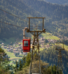 A cable car gondola coming up the hill towards the Swiss town of Bellwald © Maik
