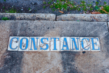 Traditional Constance Street Tile Inlay on Sidewalk in Uptown Neighborhood in New Orleans, Louisiana, USA