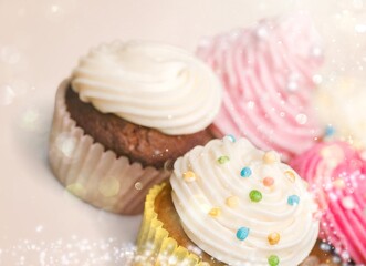 Many different cupcakes with decorations and toppings in a pastry shop concept