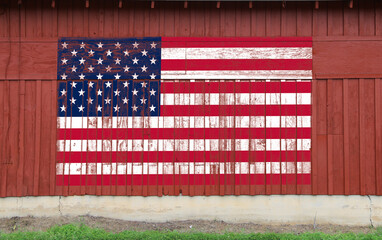 red barn wall american flag painted faded worn weathered farmland heartland america symbol patriotism building - obrazy, fototapety, plakaty