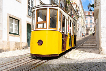 Fototapeta na wymiar Yellow typical Bica elevator in Lisbon, Portugal.