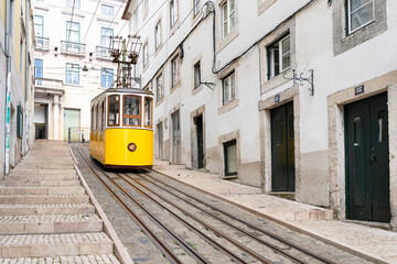 Fototapeta na wymiar Yellow typical Bica elevator in Lisbon, Portugal.