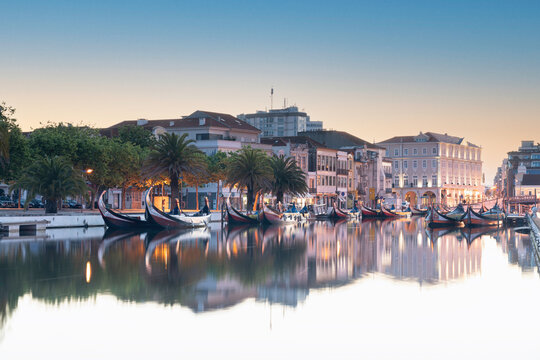 View of the main channel of the Ria de Aveiro in Portugal with the traditional boats Moliceiros