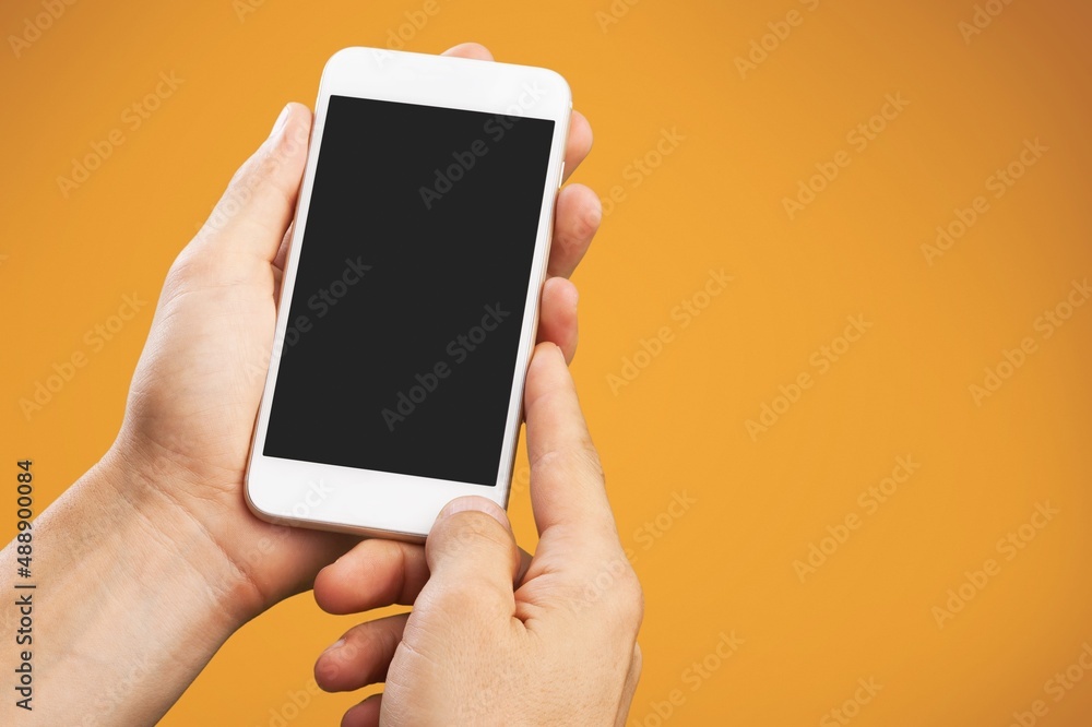 Poster Human hand using smartphone with a blank screen