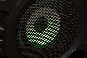 music speaker with green backlight close-up