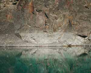 Reflection of a rock in the water