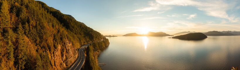 Aerial Panoramic View of Sea to Sky Highway on Pacific Ocean West Coast. Sunny Winter Colorful Sunset. Located in Howe Sound between Vancouver and Squamish, British Columbia, Canada. © edb3_16