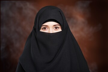 Naklejka premium Portrait of young woman in black burqa with hidden face,