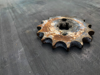 the rusty gear is left on the table