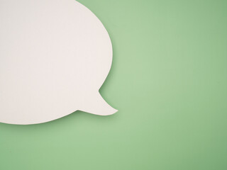 Blank white speech bubble part over a green background