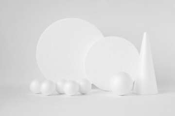 Geometric podiums for product demonstrations. Three-dimensional balls, circles, polystyrene cone on...
