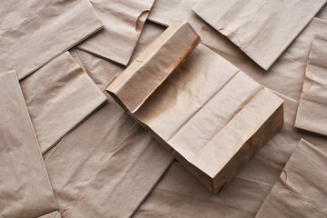 A top view image of a small brown paper lunch bag.