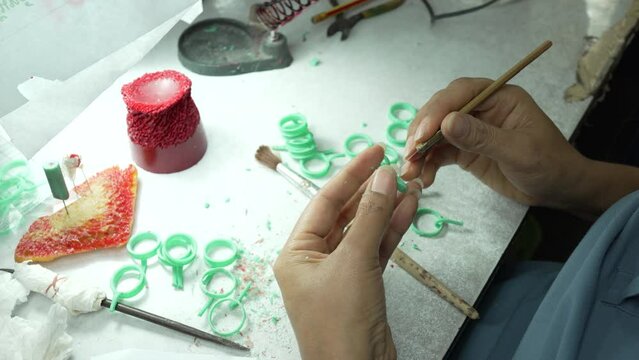 Jewelry craftsmen forming candles to make jewelry molds in a factory. Making wax jewelry before casting,process of making jewelry.