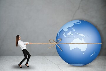 Businessman lifting the earth globe in challenge concept