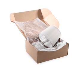 Lamp with bubble wrap in cardboard box isolated on white