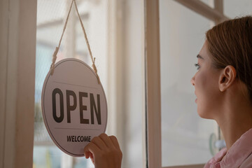 Smiling young asian business owner, employee retail,coffee shop woman,girl turning,setting sign...