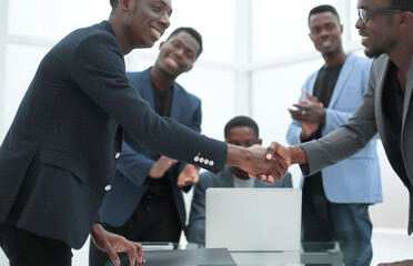 reliable handshake of business partners over the desktop.