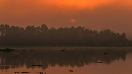 The background of the sea by the evening sea, with natural beauty (sea water, rocks, sky) and fishermen are fishing by the river bank, is a pleasure during travel.