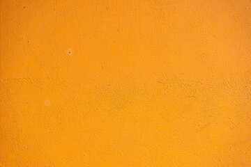 Abstract yellow cement wall texture and background. Modern grafitty wallpaper. A wall have some grunge effects and lines.