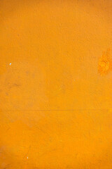 Abstract yellow cement wall texture and background. Modern grafitty wallpaper. A wall have some grunge effects and lines.