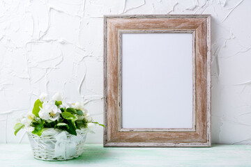 Wooden picture frame mockup with apple tree flowers
